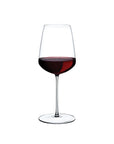 A tall and large clear glass filled with red wine, designed for enhancing the flavor of powerful red wines.