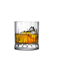 A clear double old-fashioned whiskey glass filled with ice and a golden-brown liquid, showcasing vertical ridges on its surface.