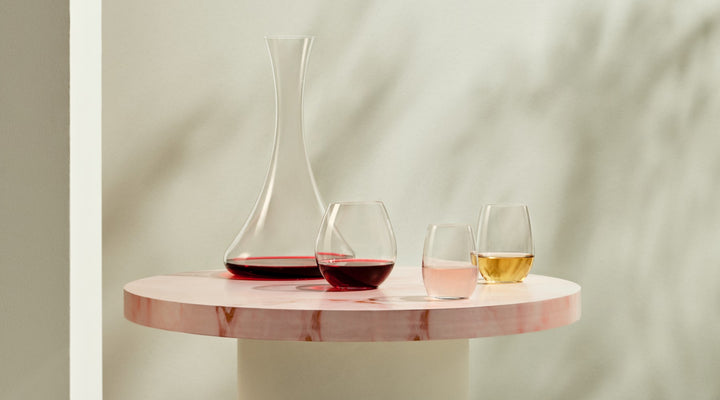 NUDE Pure collection, a range of stemless glasses, here the bourgogne, white wine and digestive glass presented with the minimal and tall Jazz decanter