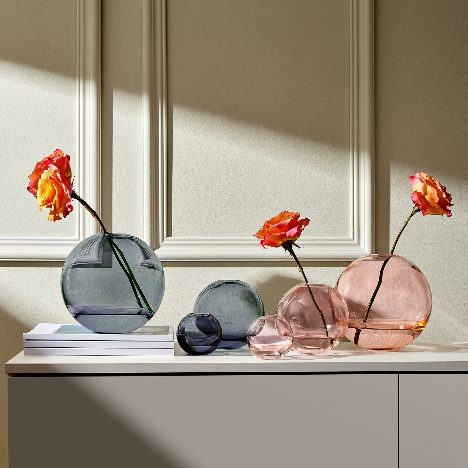 NUDE Mars spherical vases collection in orange and steel blue inspired by the planet Mars and its moons