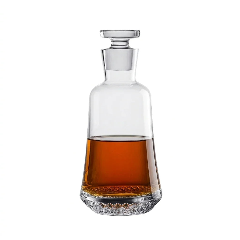 NUDE Paris whisky bottle shaoed with a round base going smaller to the top, inspired by the Eiffel tower. Presented empty on white background