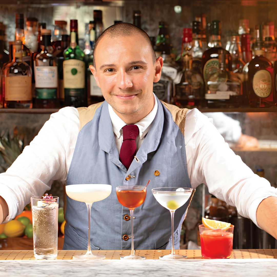 Rémy Savage mixologist and philosopher with NUDE Savage cocktail glass collection at bar