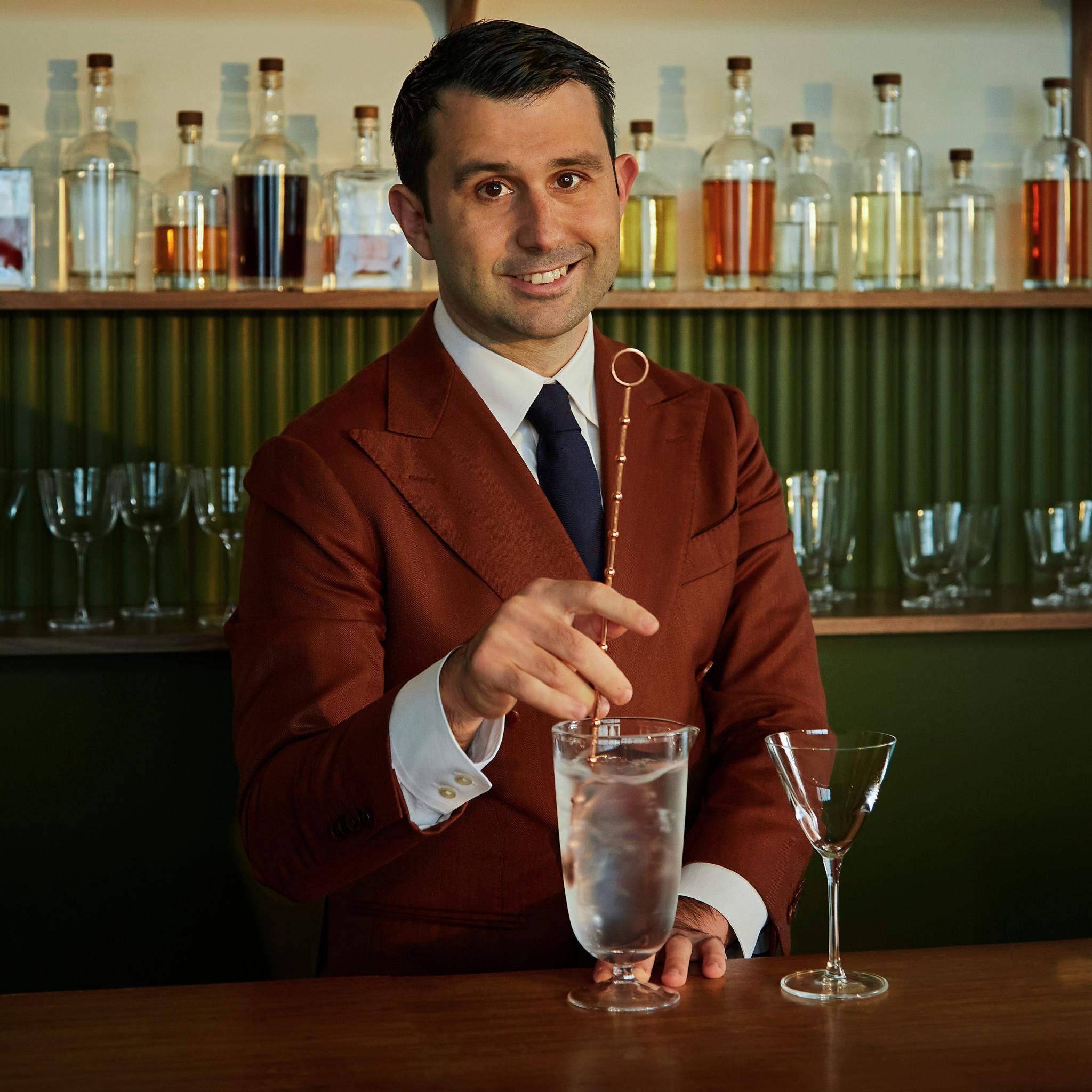 Giorgio Bargiani stirring a cocktail in the NUDE Bar/Giani Mixing Glass