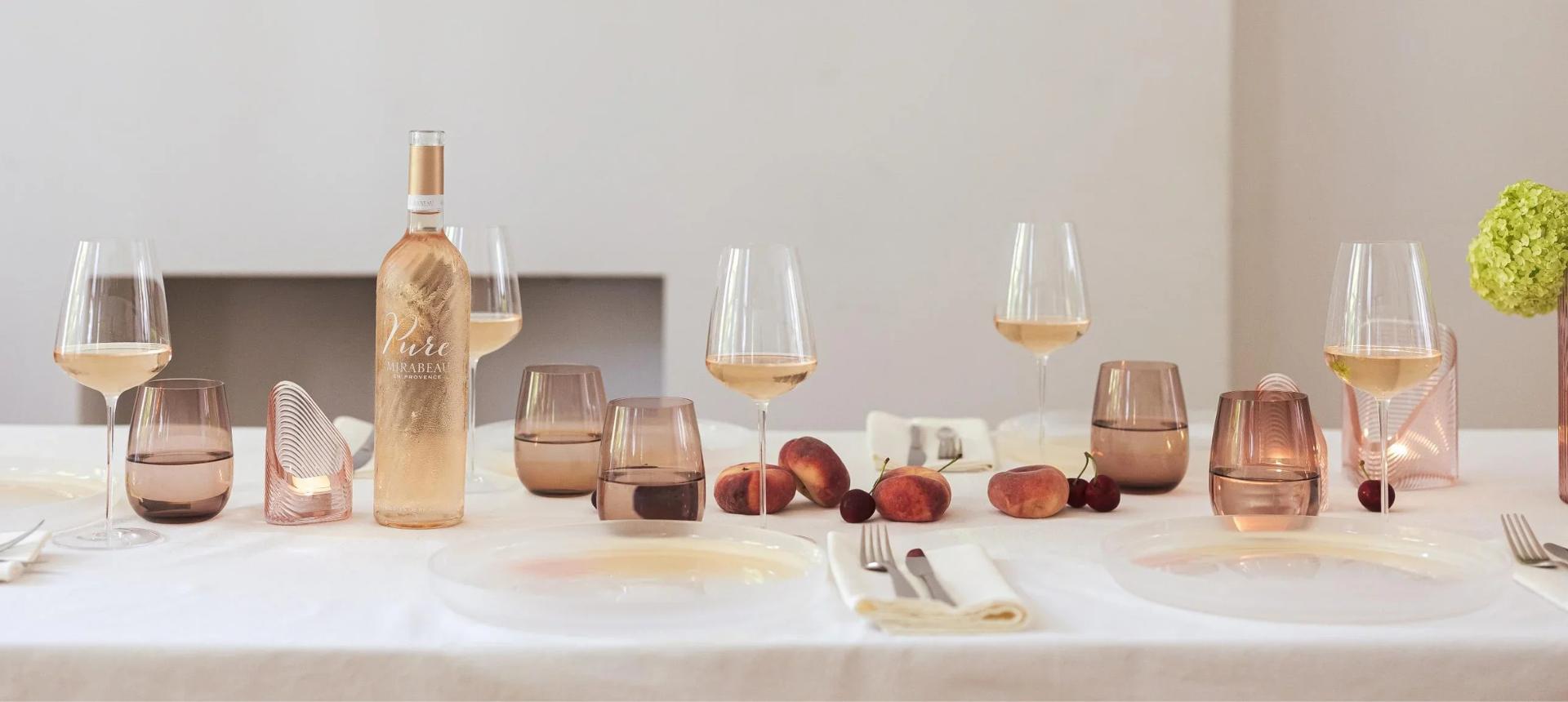 NUDE Stem Zero Vertigo Delicate White Wine glasses with Mirabeau Pure Provence rosé, Mist votives, Pigmento plates and Colored U tumblers on an elegant table setting