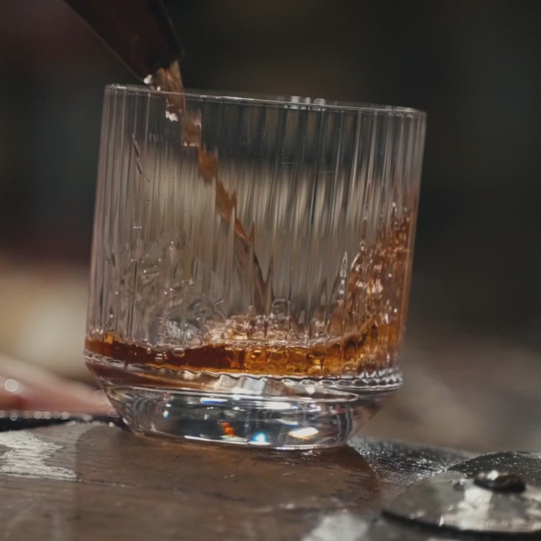 Nude glass Big Top whisky glass where whiskey is being poured into. 