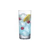 NUDE Caldera high ball glass filled with a light blue cocktail