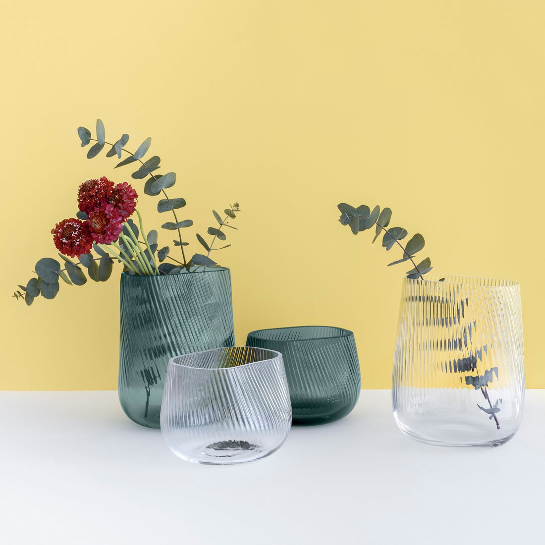 Group Opti Vases by Defne Koz in clear and smoked green